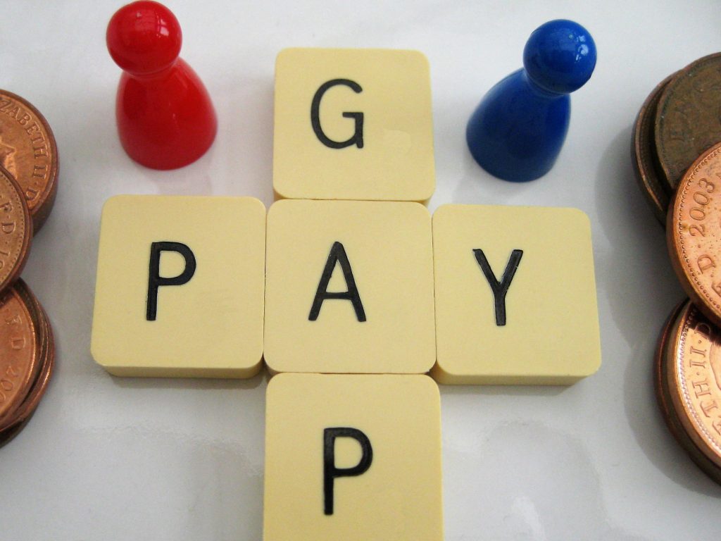 Pay gap spelled out in scrabble tiles